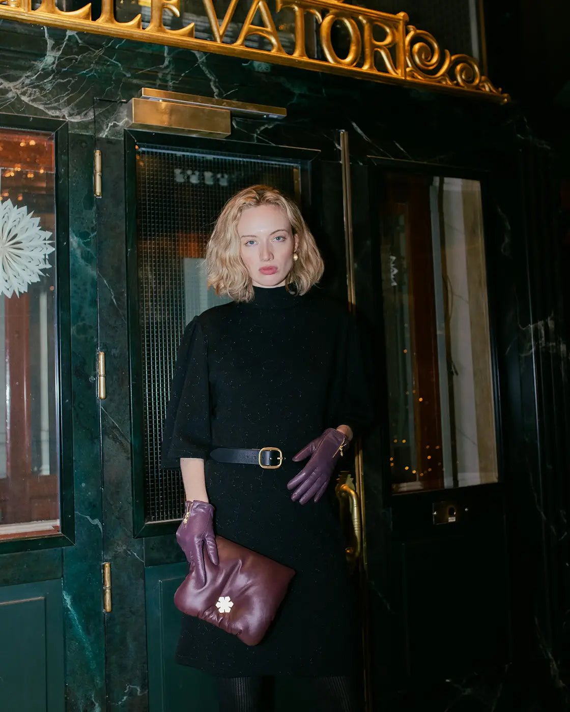 The Kensington Grand Belt Gold is adorned with a handcrafted 14 karat gold-plated brass buckle and a debossed Kalmus flower, RHANDERS.