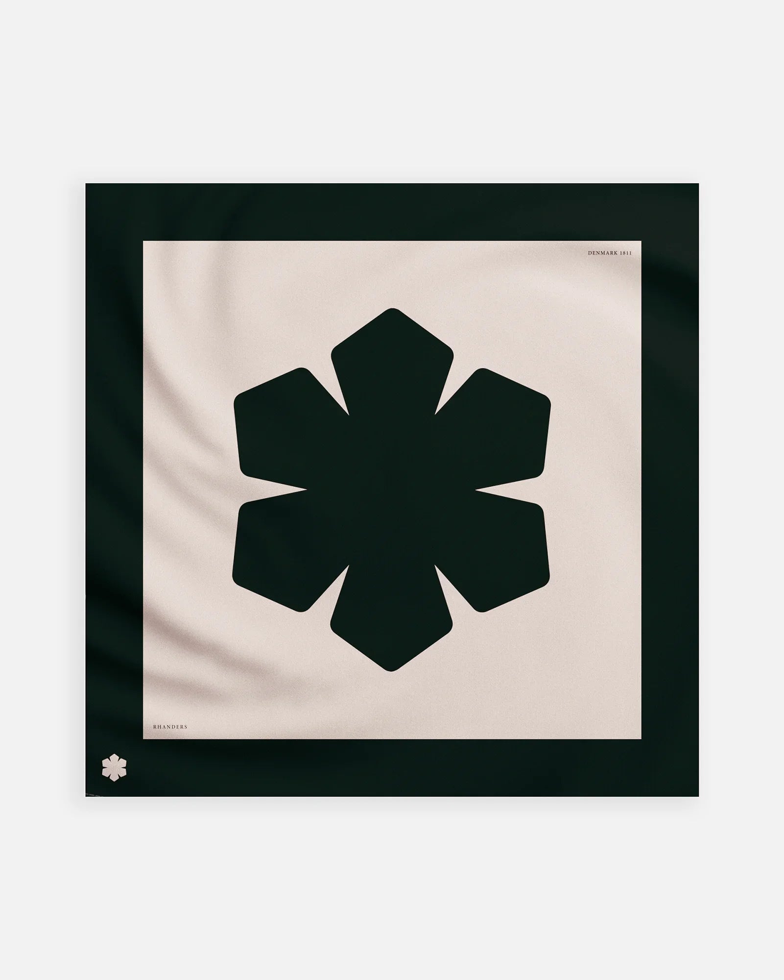 The Aida Scarf in a black and champagne colour way adorned with a grand, centered Kalmus flower and a coloured frame featuring our Kalmus flower, RHANDERS, and DENMARK 1811.