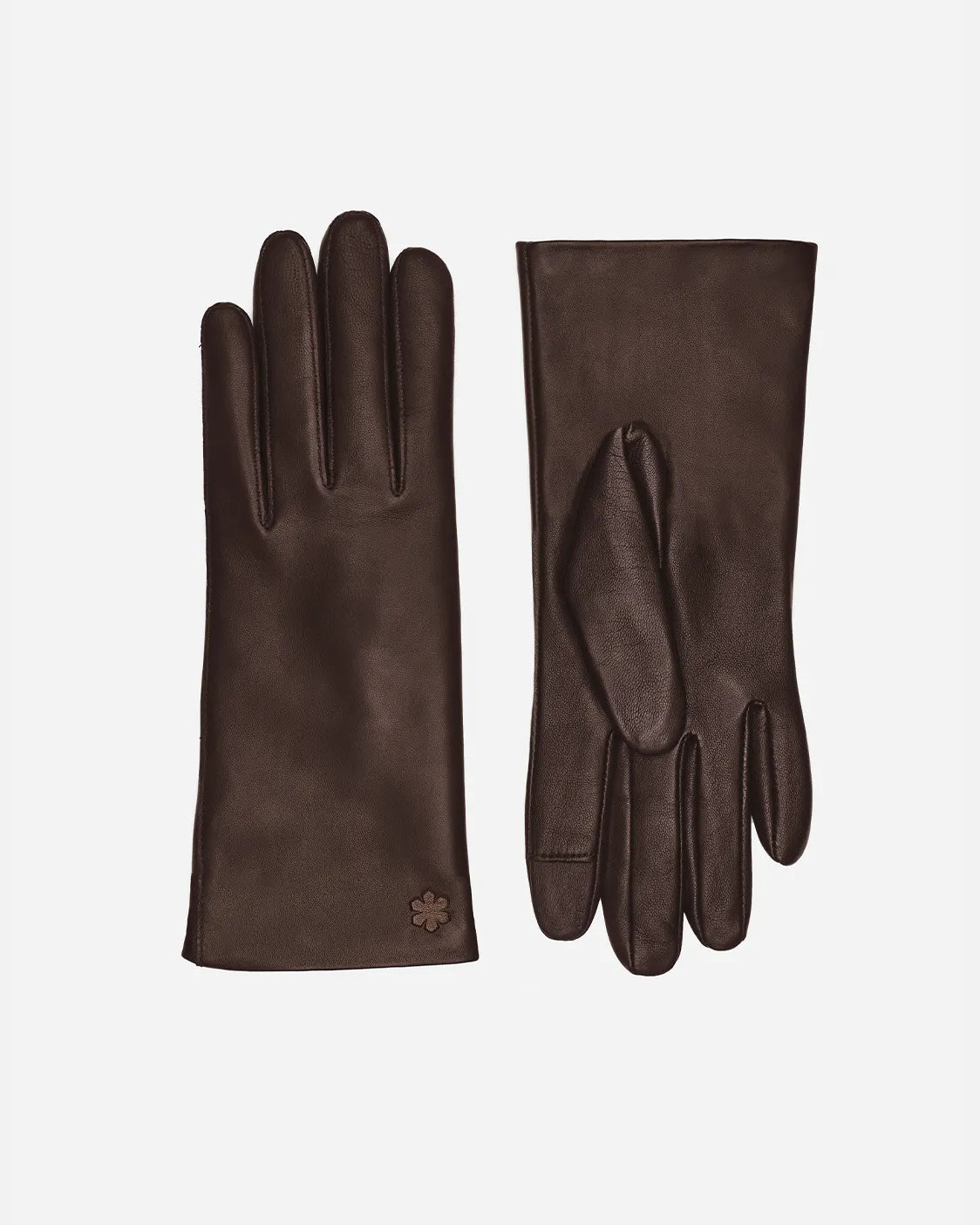 Alma er en elegant hverdags handske. Fremstillet af det fineste lammeskind, prydet med en præget Kalmus blomst og touch teknologi fra RHANDERS.