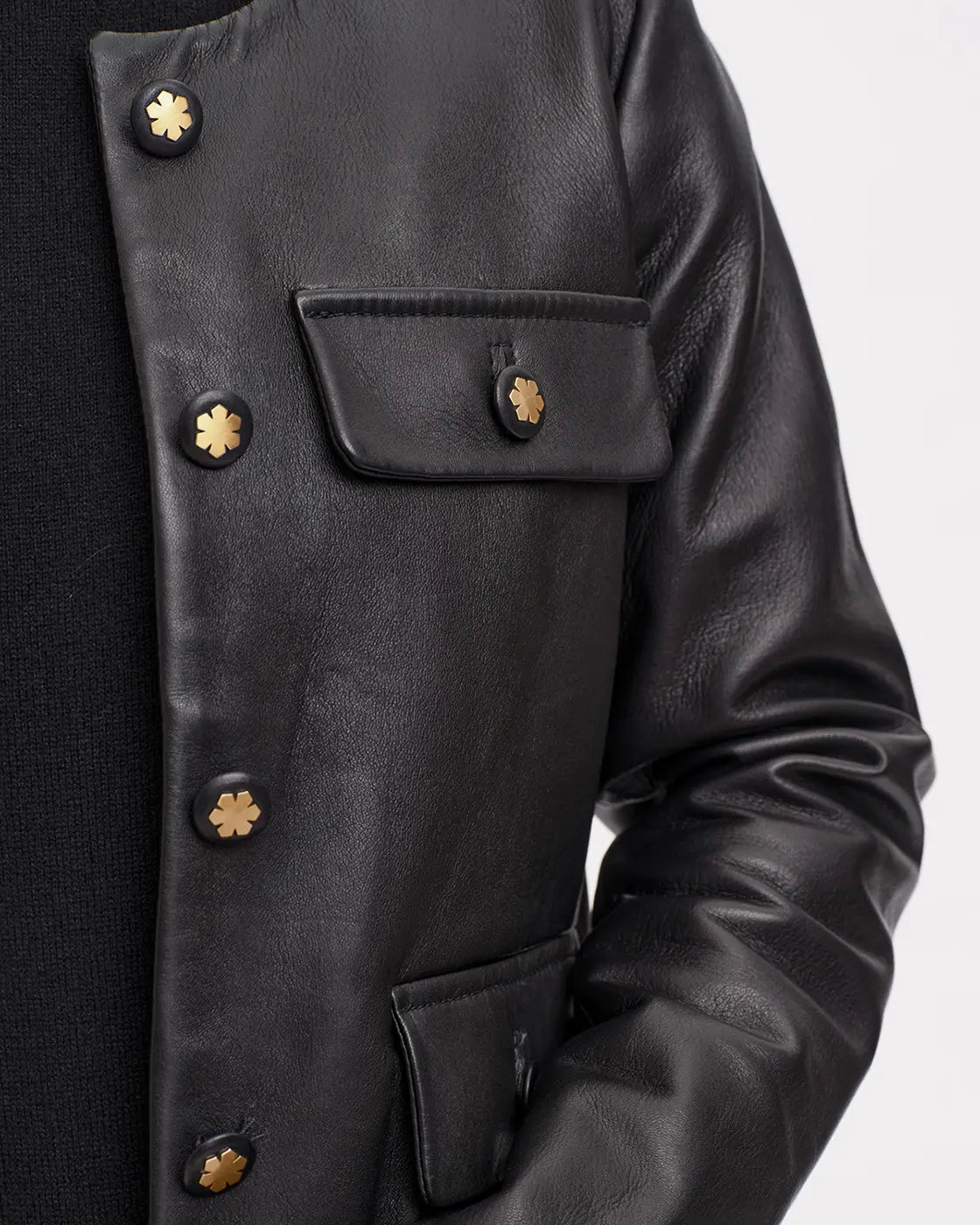 The Anna Classic Jacket is crafted from the most exquisite lamb leather, offering a butter-soft touch, and is adorned with 14 karat gold-plated Kalmus flower buttons.