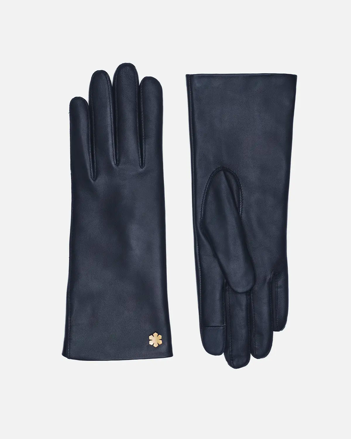 Explore the classic glove for women, Anna, in navy. Crafted from butter-soft lamb leather with soft wool lining, and adorned with a 14 karat gold-plated Kalmus flower, RHANDERS.