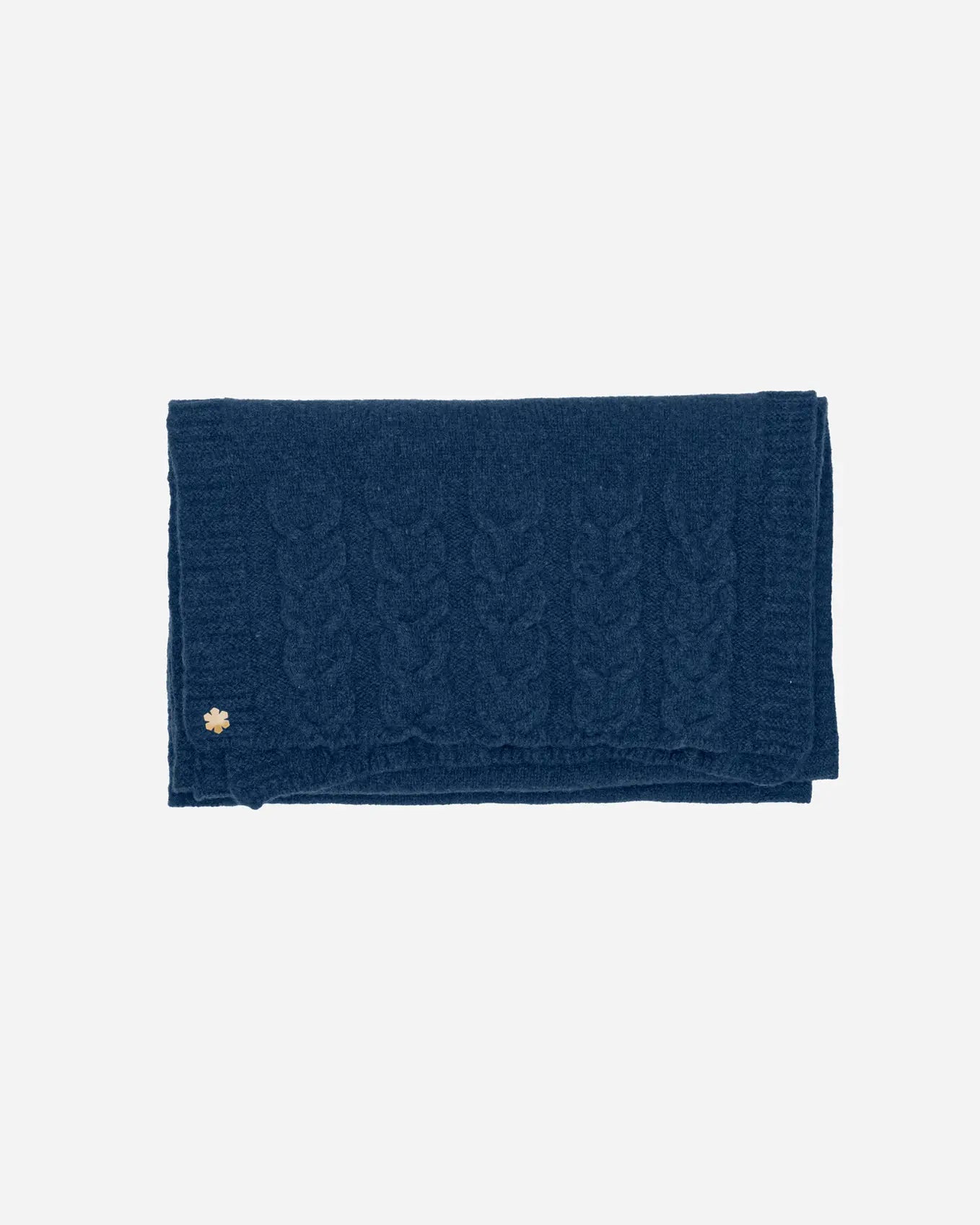 The Arie Scarf in the colour atlantic blue adorned with knitted details and a 14 karat gold-plated Kalmus flower in one corner.