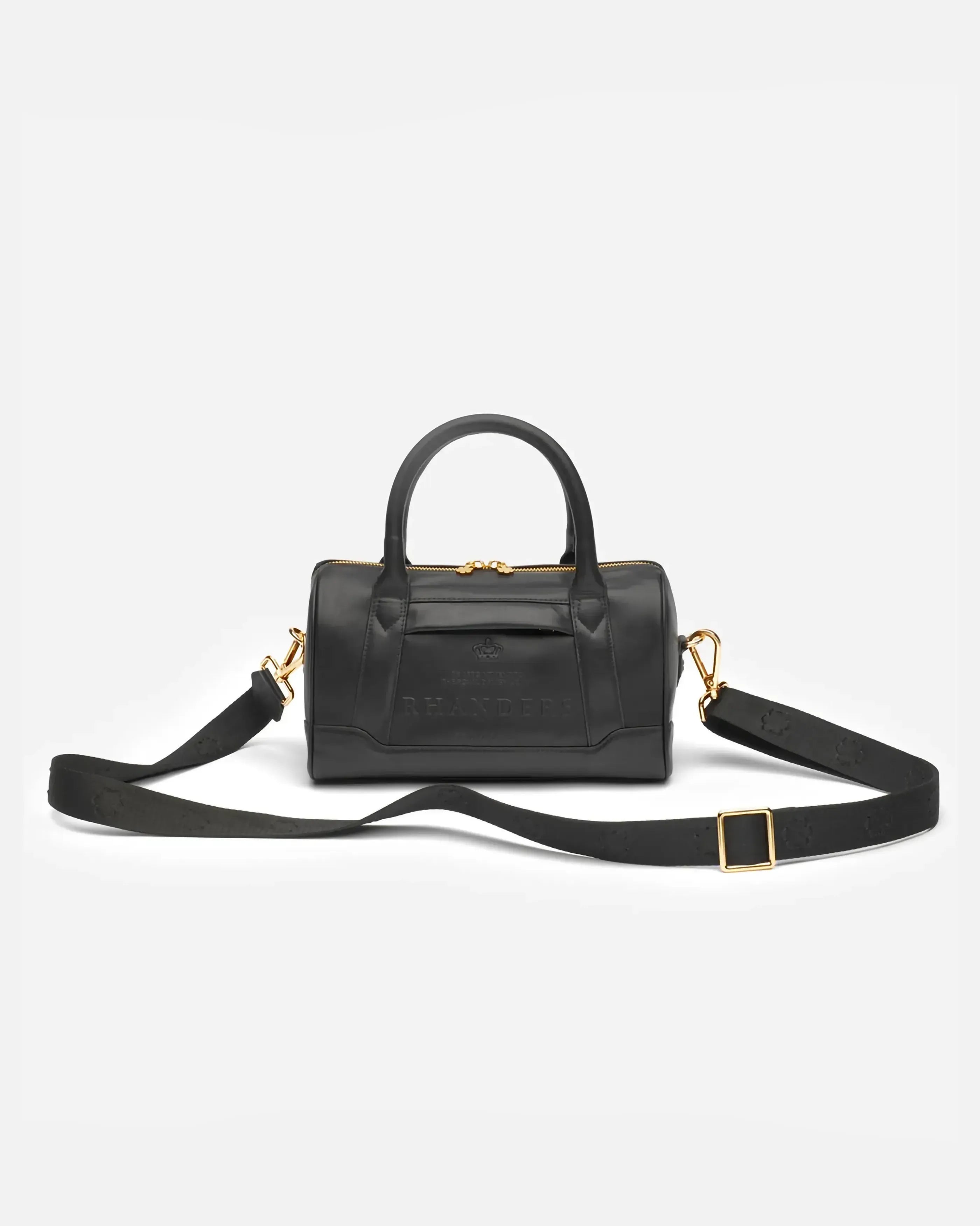 Elegant and timeless handbag from RHANDERS with adjustable textile and leather shoulder strap with embossed Kalmus flower details