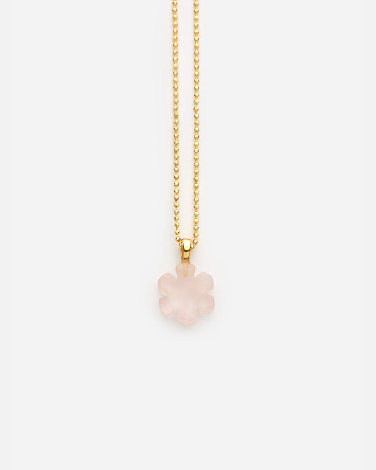 Our Crystal Kalmus Necklace from RHANDERS is made from rose quartz with the shape of the Kalmus flower.