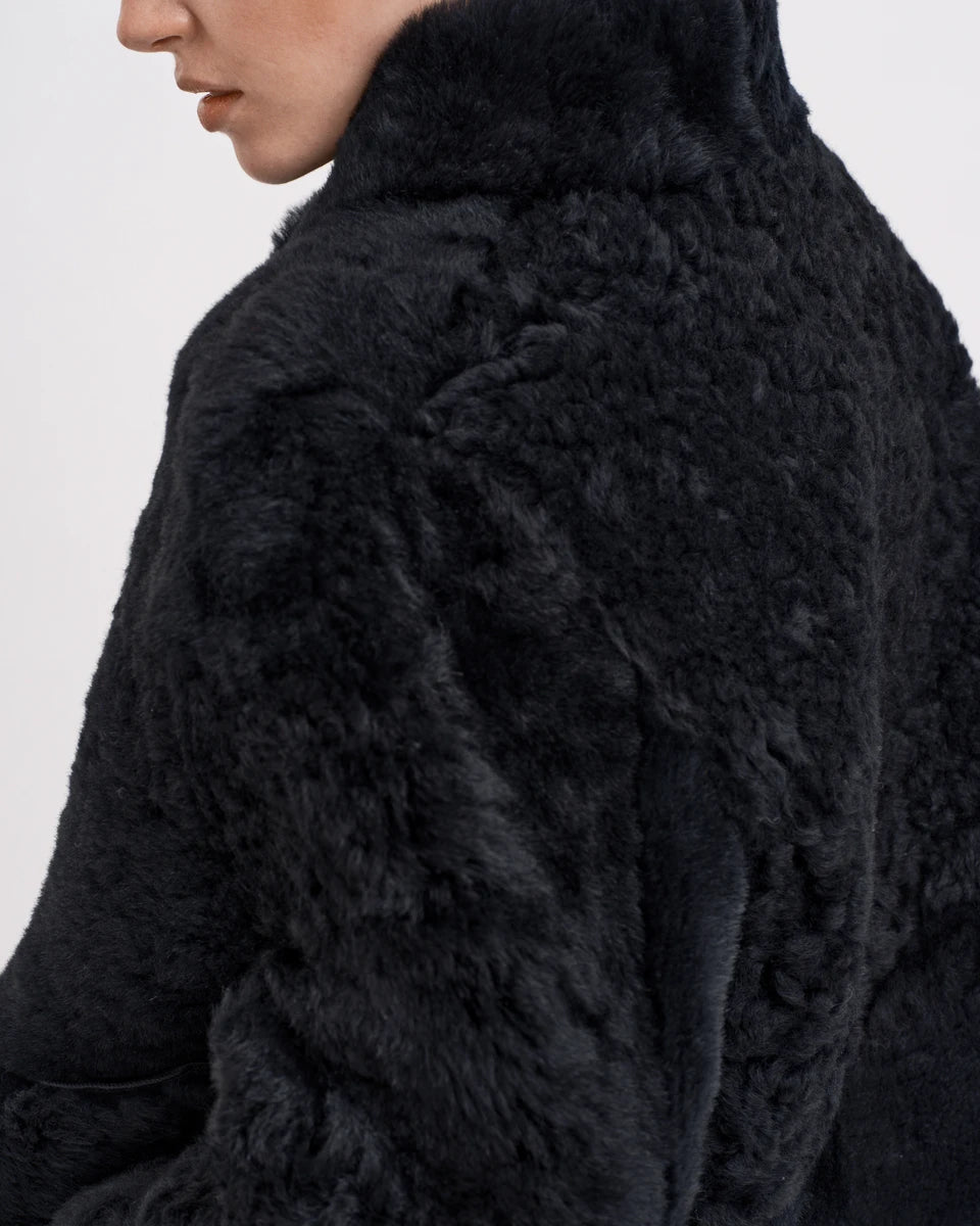 The elegant and classic Helena Jacket from RHANDERS is reversible, creating two jackets in one - soft long wool on one side and velvet soft suede on the other side