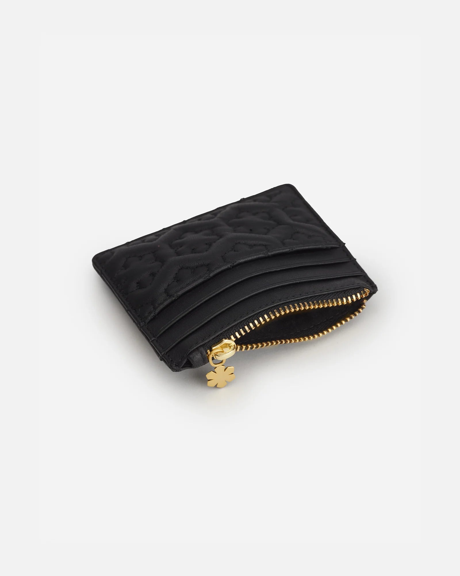 Wallet from RHANDERS. Black and quilted in a kalmus flower pattern. Room for cash and cards.