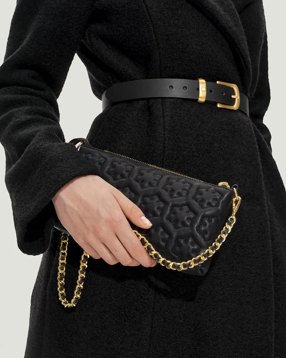The Isabella Clutch from RHANDERS made from the finest lamb leather with Kalmus quilted design and a stunning gold chain with leather details.