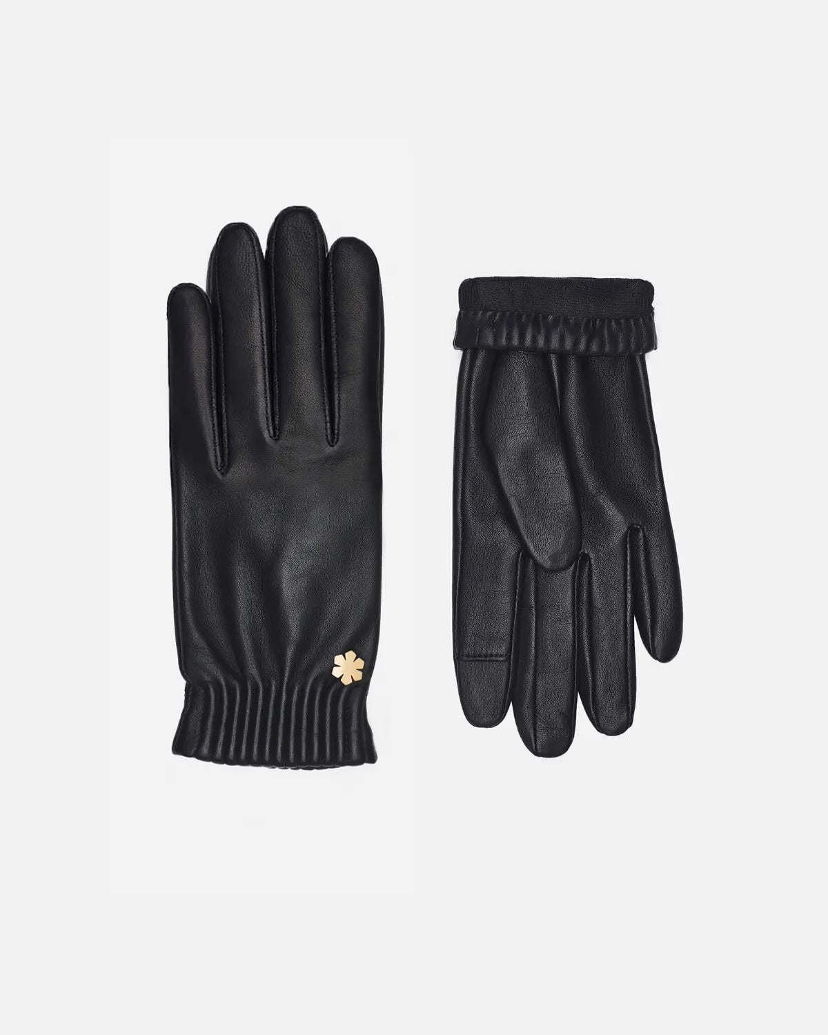 Tidløs og elegant damehandske fra RHANDERS fremstillet i det fineste lammeskind i en smuk sort farve, prydet med en 14 karat forgyldt Kalmus blomst.