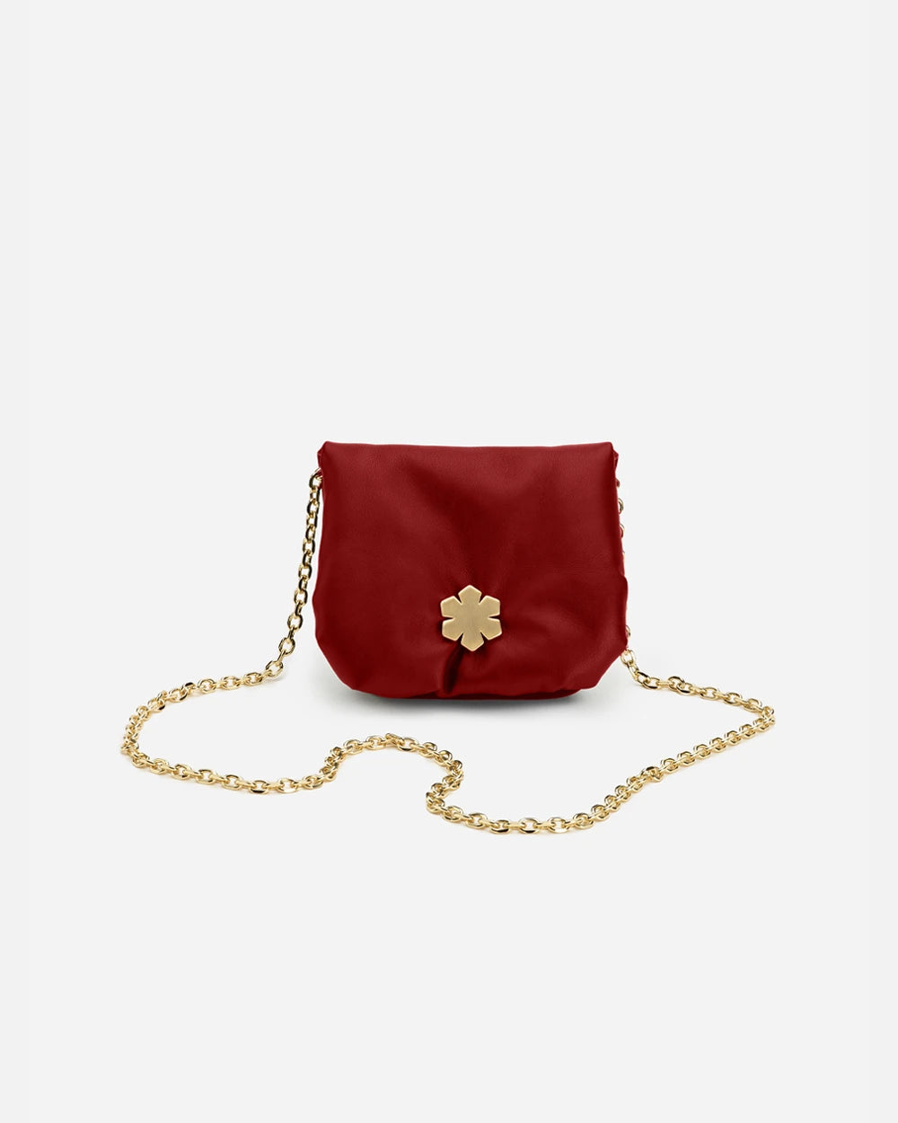 Premium handmade bag crafted from glove leather. 14K plated Kalmus feature as part of the elegant magnetic closure. Red colour