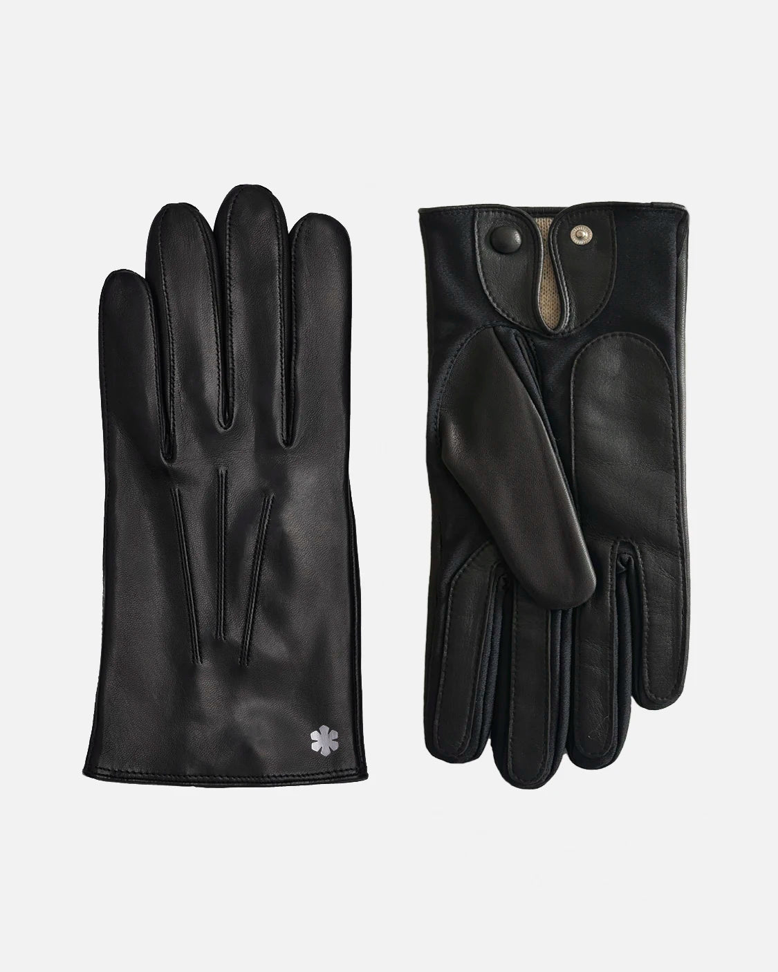 The Winston One-size from RHANDERS is a classic and elegant gloves for men. Crafted from hair sheep leather with wool-blend lining, a button closure, and adorned with hematite Kalmus flower.