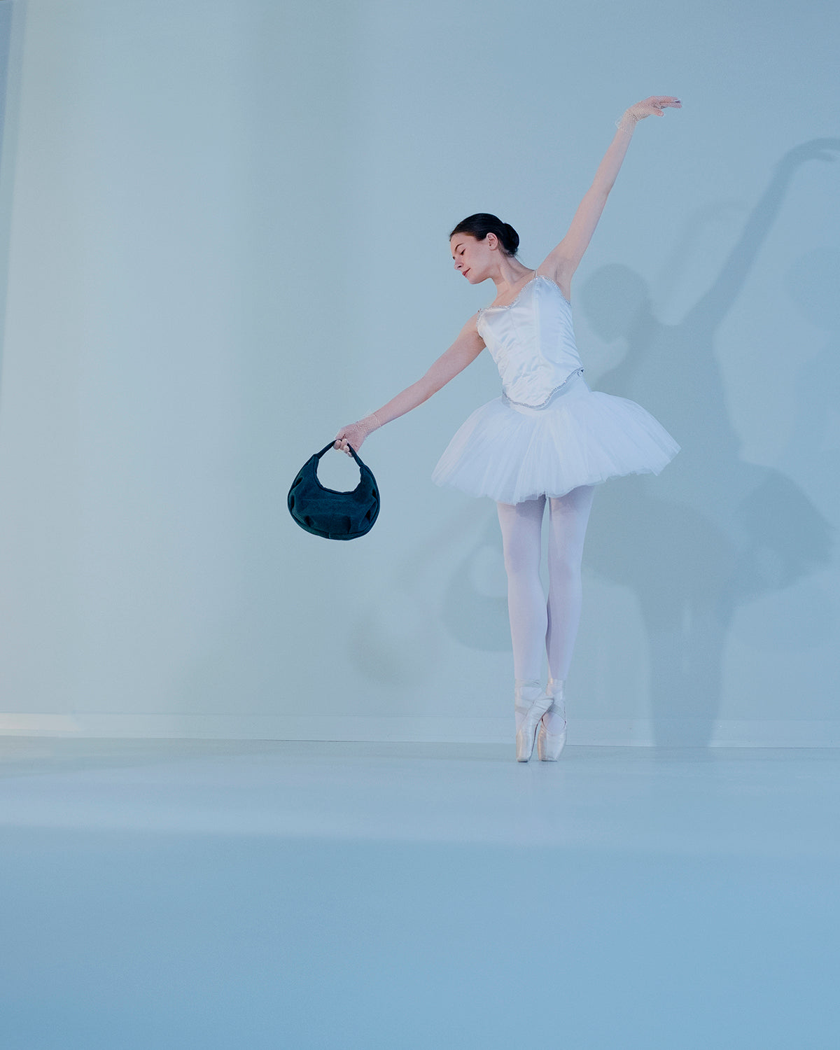 Soft and intricately luxury bag SWAN BAG CLASSIC with no visible outer seams or hardware in the colour forest green.