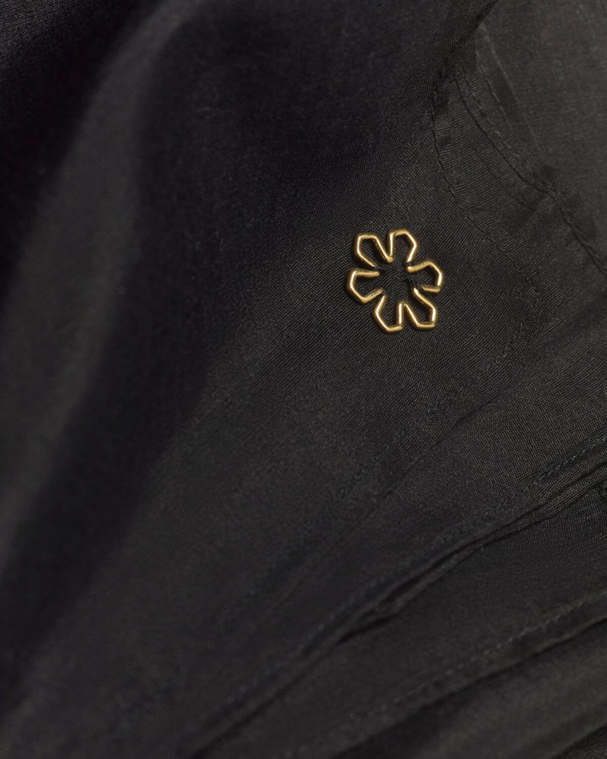 Black Ava women’s scarf adorned with a 14 karat gold-plated outline Kalmus flower.