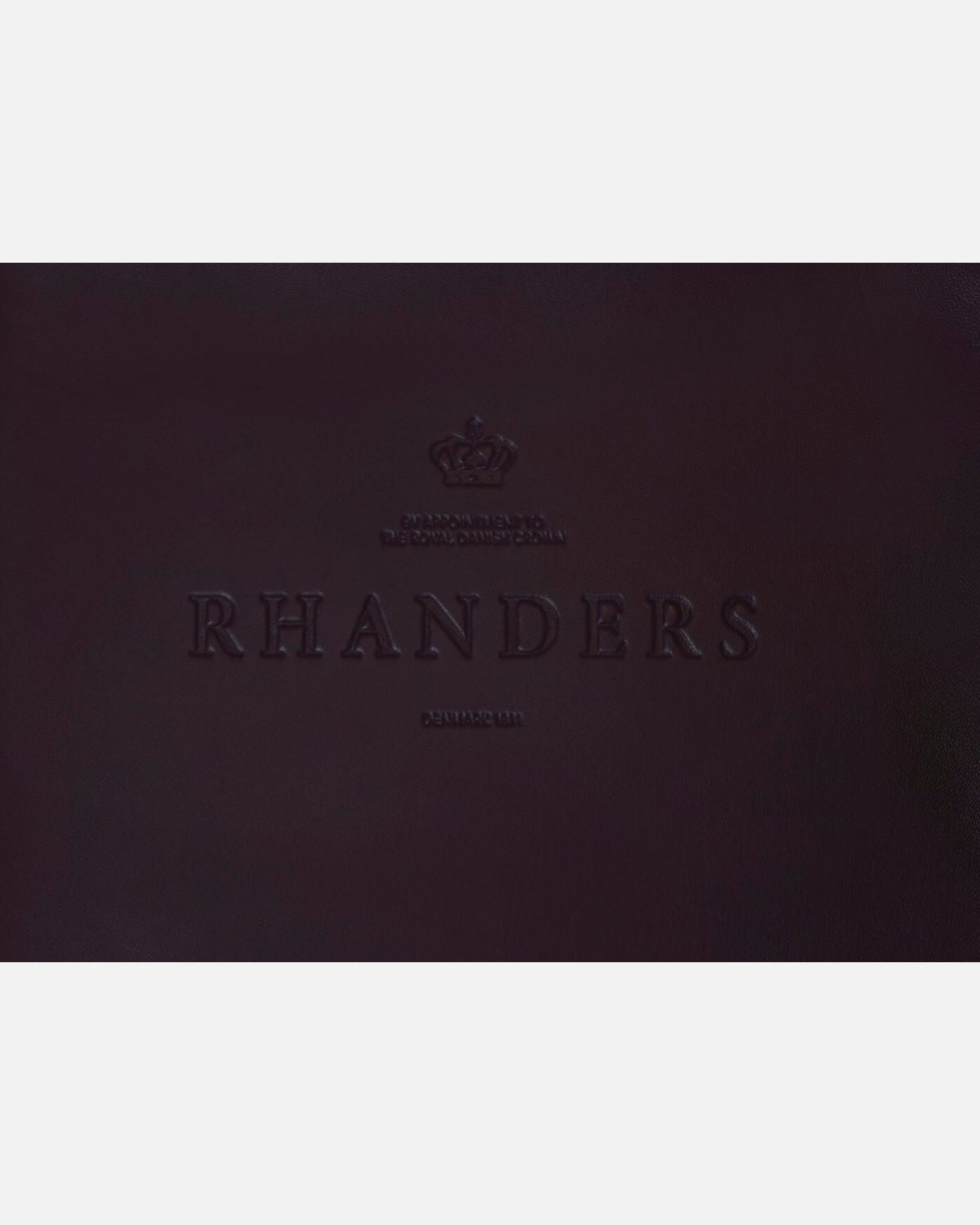 The Sophia 16’’ long gloves from RHANDERS are crafted from lamb leather and adorned with 14 karat gold-plated Kalmus flowers.