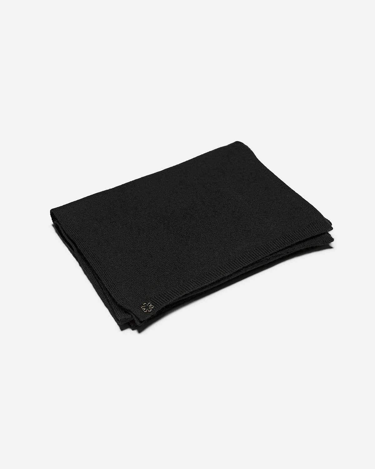 Black Amour women's scarf adorned with a subtle rib and a 14 karat gold-plated outline Kalmus flower in one corner.