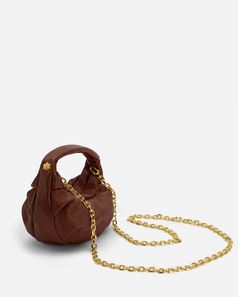 Handcrafted designer bag in the color 'Chocolate' with no visible outer seams or hardware, making it both endearingly timeless and completely modern.