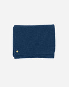 The Alex Scarf in the colour atlantic blue adorned with a 14 karat gold-plated Kalmus flower in one corner.