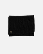 Black Alex Scarf for women adorned with a 14 karat gold-plated Kalmus flower in one corner.