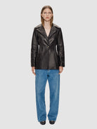 The Cecilia Blazer is made from the finest Italian glove leather, adorned with elasticated waist and 14 karat gold-plated Kalmus flower buttons, RHANDERS