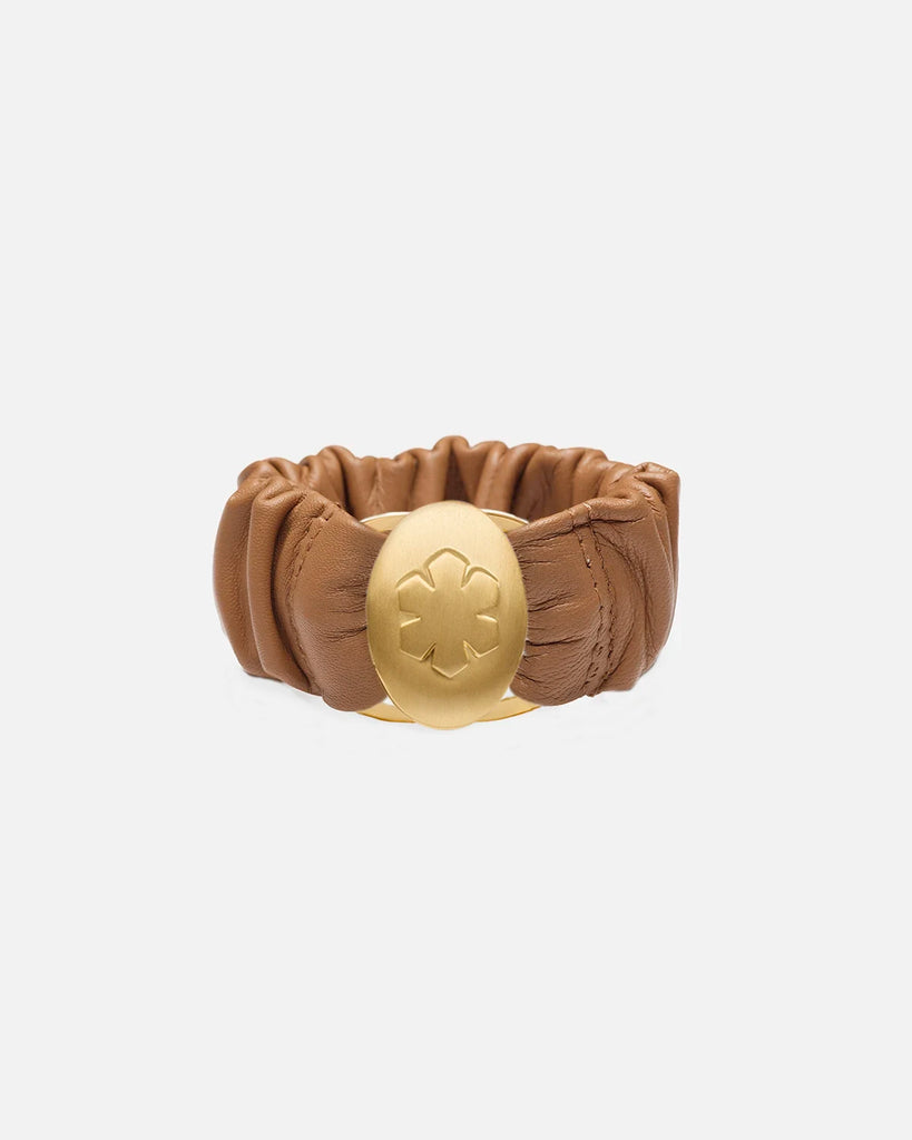 Camel leather bracelet adorned with a beautiful 14k gold pleated amulet, that stores two images, from RHANDERS.