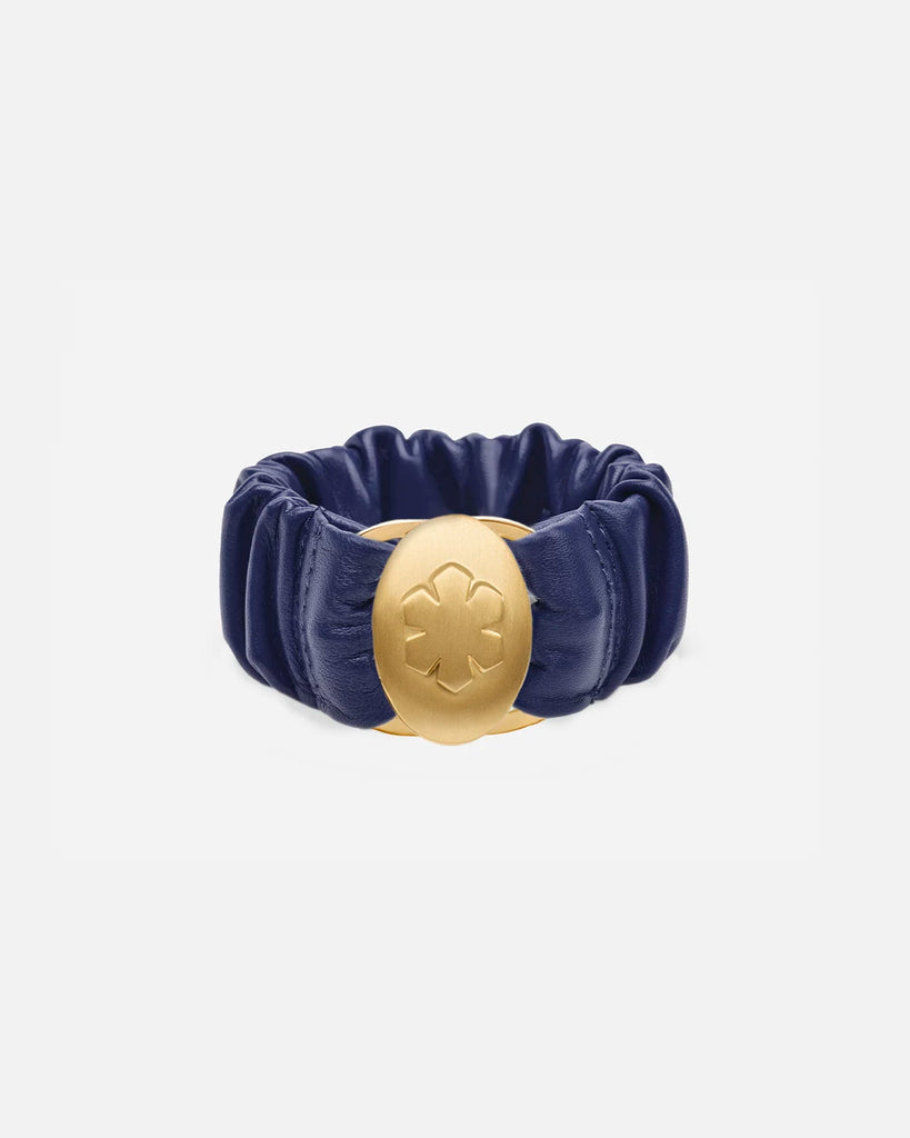 Royal Metallic leather bracelet adorned with a beautiful 14k gold pleated amulet, that stores two images, from RHANDERS.