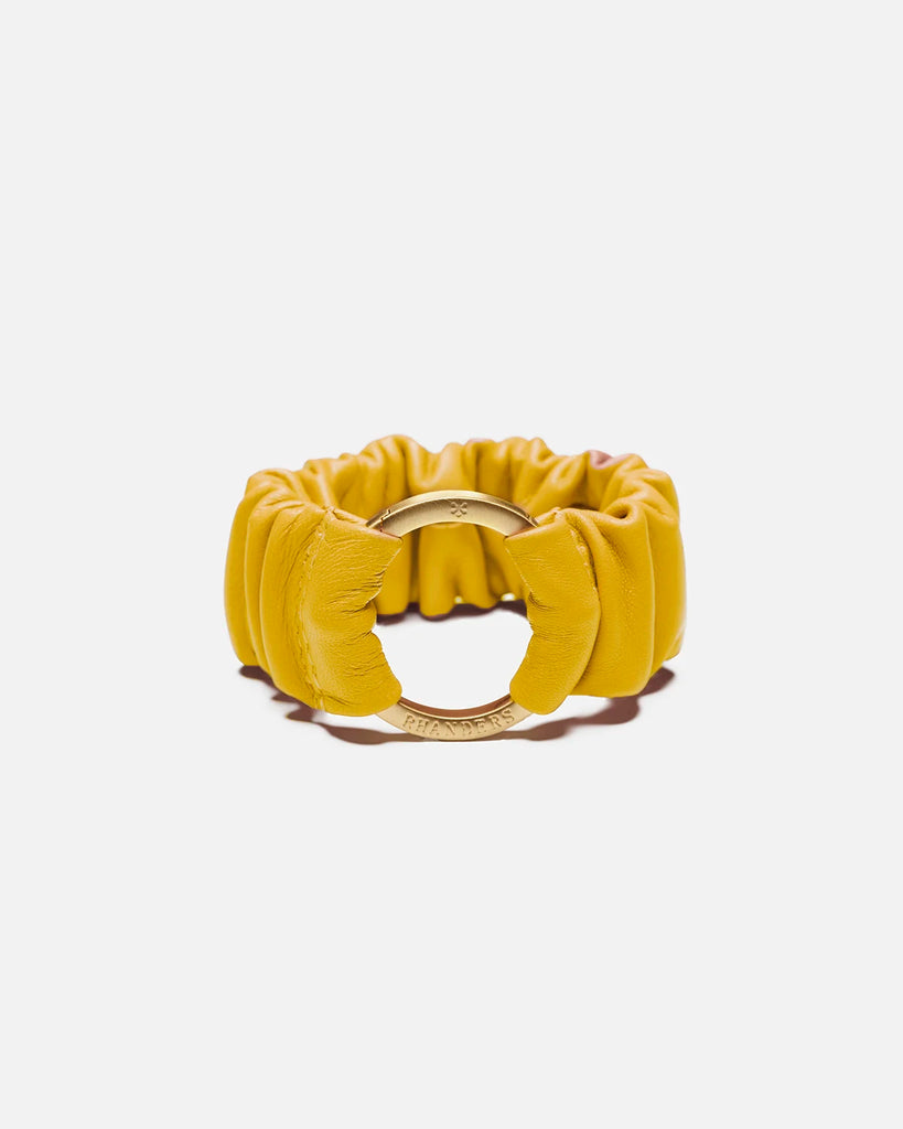 Yellow women's bracelet with a gold plated clasp. Made from 100% lamb leather and elasticated for comfortable wear.