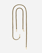 The elegant Gold Chain with Leather from RHANDES is plated with 14 karat gold, detailed with glove leather, and comes both as a cross-body and shoulder chain.