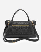 Spacious travel bag from RHANDERS with quilted Kalmus flower shapes, zipper pullers with Kalmus details, and glove leather handles and wide shoulder straps.