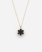 The Leather Fusion Kalmus Necklace is crafted from the finest 14 karat plated gold, adorned with a Kalmus flower with butter-soft glove leather at the center, RHANDERS.