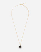 Adjustable necklace from RHANDERS with   the signature Kalmus flower adorned with soft glove leather at the center. 
