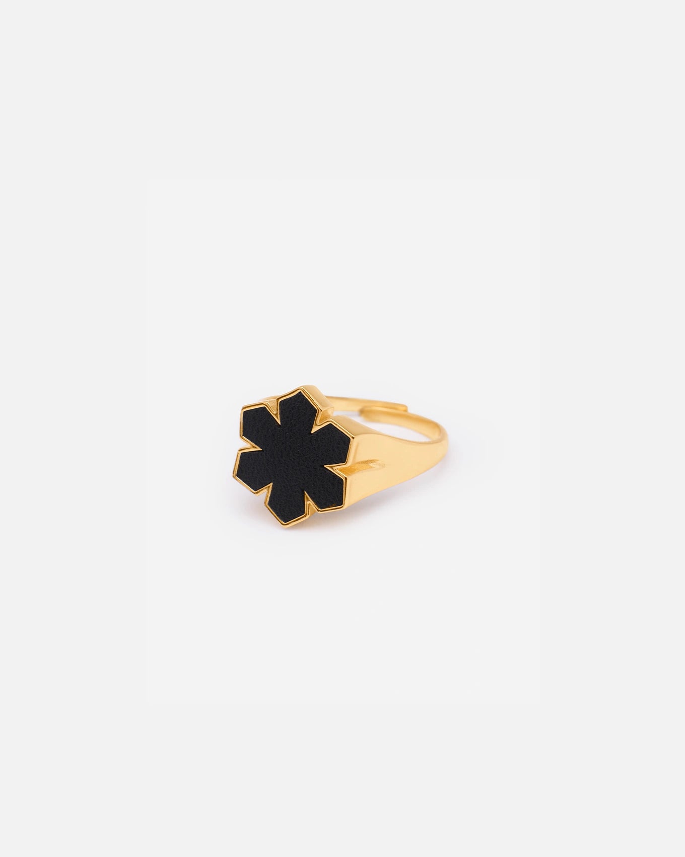 The Leather Fusion Kalmus Ring from RHANDERS is crafted from 14 karat plated gold, adorned with the signature Kalmus flower with butter-soft glove leather at the center.