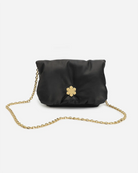 Louisa Clutch Grand from RHANDERS is made from the finest glove-leather in black, adorned with a Kalmus flower magnet closure and a 14 karat gold-plated bag chain.