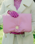 Handmade from glove leather, the Louisa Clutch Grand from RHANDERS is adorned with signature detail, the Kalmus flower.   