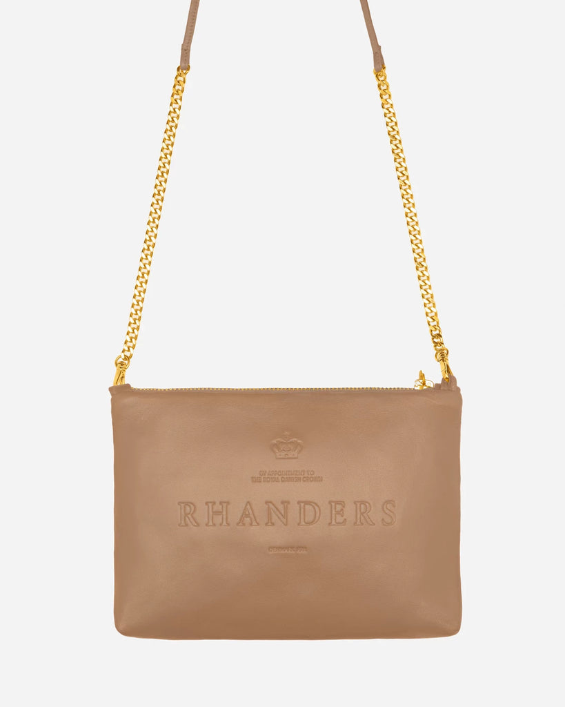 Beautifully handcrafted pouch from RHANDERS. Adorned with a 14K gold chain strap and front pockets.