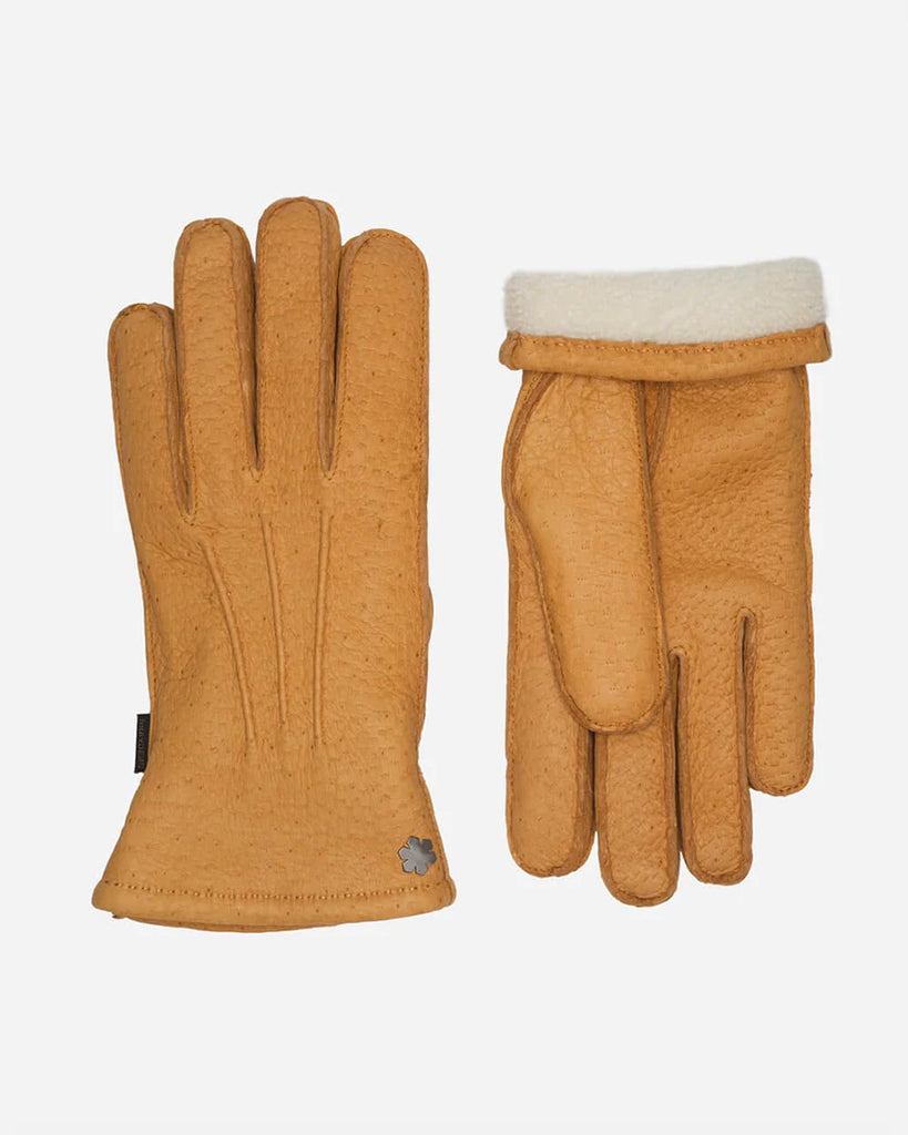 Mustard coloured glove in peccary that has an exquisite feel but is strong enough to last a lifetime.