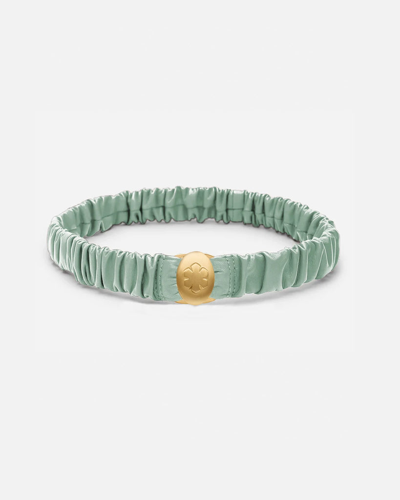  Elegant mint belt in soft lamb leather, decorated with a 14k gold pleated amulet with room for two personal images.