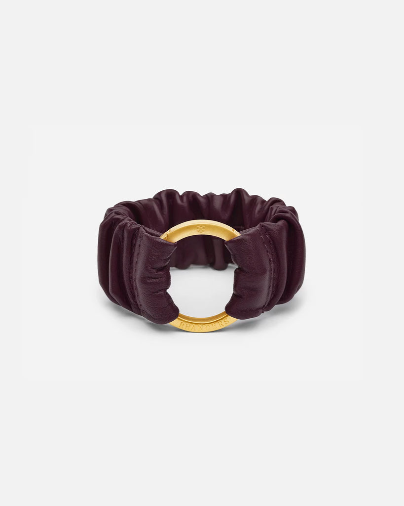 Plum women's bracelet with a gold plated clasp. Made from 100% lamb leather and elasticated for comfortable wear.