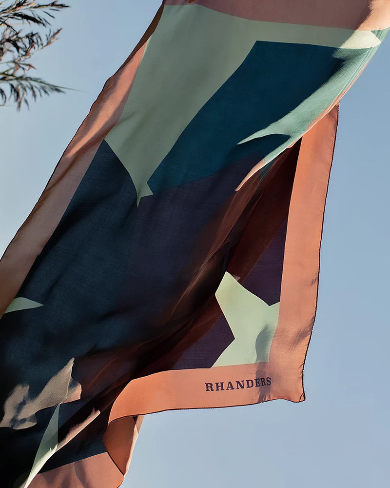 Discover the silky Grand Kalmus Scarf from RHANDERS, a must-have for everyday elegance.