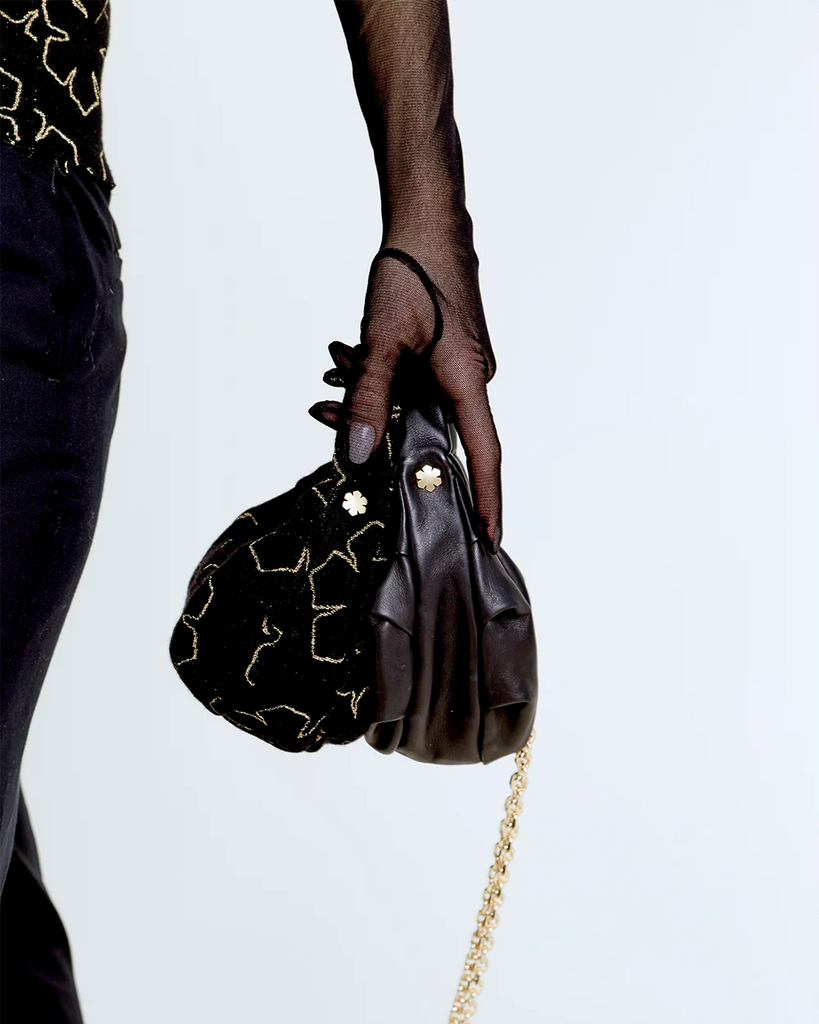 Mini RHANDERS swan bag in soft black glove leather, ideal for an elegant and luxuroius look.