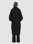 The Tulip Coat - Wool comes in black with buttons covered in wool and bejewelled with 14 karat gold-plated Kalmus flowers, RHANDERS.