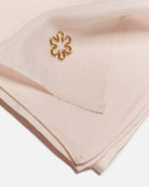 Large and timeless "AVA" silk scarf in the colour champagne.