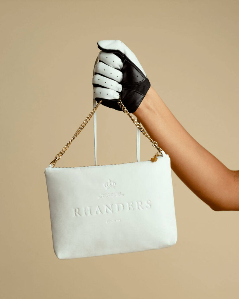 Classic and timeless leather pouch for women in the colour white.