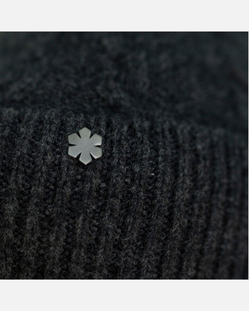 Warm and soft knitted wool beanie in the colour charcoal.