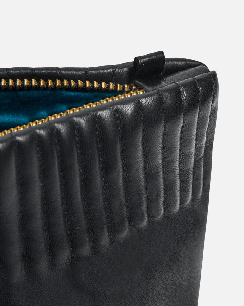 Beautiful and unique pouch from RHANDERS. The top features elastic stitches as per the Cecilia glove – creating a collection coherency around this specific detailing.