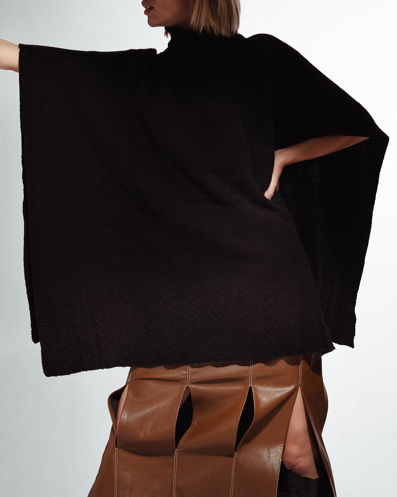 Soft and warm women's poncho with holes for belt styling from RHANDERS.