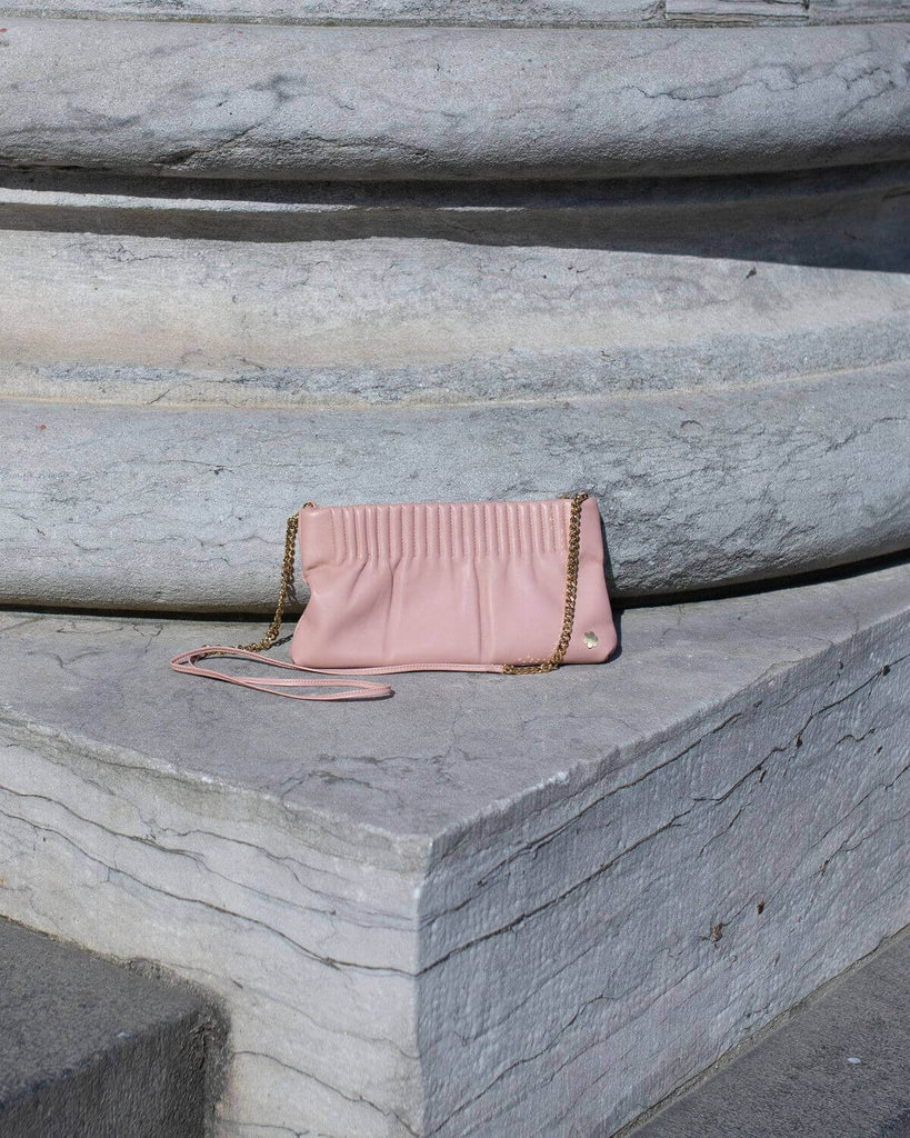 Elegant and handmade designer pouch in the colour rose. Crafted from the finest and most exquisite lamb glove-leather, offering a butter-soft touch with an astonishing world-class strength.