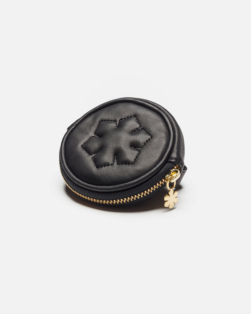Small and elegant leather bag with a 14 karat gold plated Kalmus flower zipper pull.