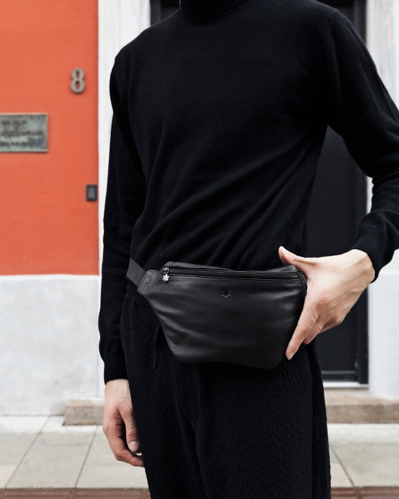 Elegance and functionality in one, classic belt bag in black leather for men, RHANDERS.