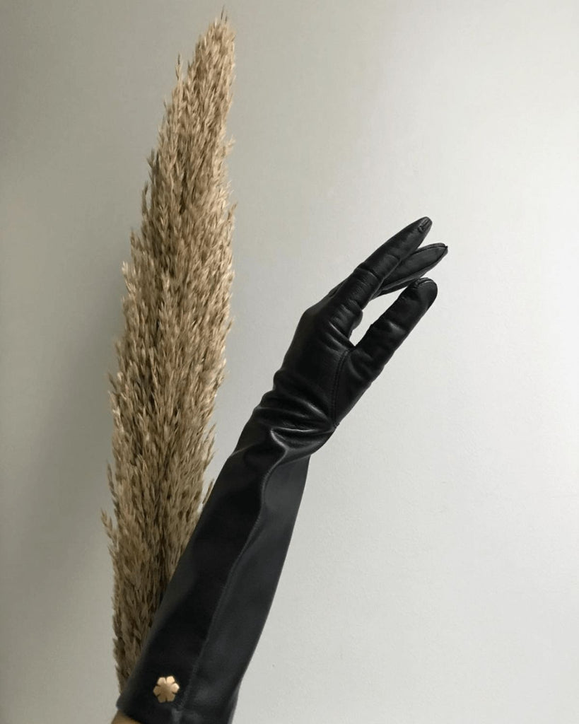 Long women's leather gloves with silk lining and gold plated kalmus-flower from RHANDERS.